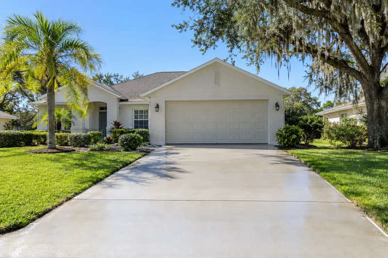 After: a concrete driveway in front of a Florida home, cleaned